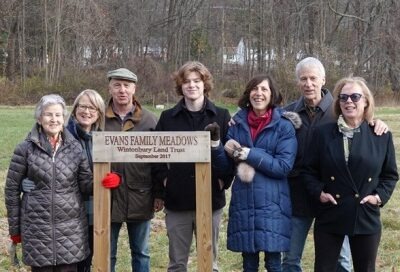 Photograph of Marguerite Evans, her daughter Dayle and husband Mike Williams, her son Donald Evans Jr. and wife Patricia, his daughter Deborah Quigley, and grandson Kaie Quigley